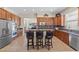 Spacious kitchen featuring stainless steel appliances, granite countertops and a breakfast bar at 6958 Lazy Sunset Ct, Las Vegas, NV 89156