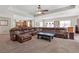 Large living area with a spacious sectional sofa, an open layout, and a modern design at 6958 Lazy Sunset Ct, Las Vegas, NV 89156
