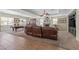 Expansive living room with a fireplace, plush seating, pool table, and ample natural light at 6958 Lazy Sunset Ct, Las Vegas, NV 89156