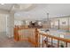 Second floor loft featuring wood railing overlooking living areas and balcony at 6958 Lazy Sunset Ct, Las Vegas, NV 89156