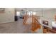 Spacious loft area with wood railings overlooking the living room below, a perfect retreat space at 6958 Lazy Sunset Ct, Las Vegas, NV 89156