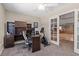Home office featuring a desk, shelving and exercise equipment with natural lighting at 6958 Lazy Sunset Ct, Las Vegas, NV 89156