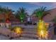 Cozy outdoor seating area with lush landscaping, creating a serene and private backyard retreat at 6958 Lazy Sunset Ct, Las Vegas, NV 89156
