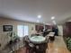 Charming eat-in kitchen featuring dark wood cabinetry, granite counters, and stainless steel appliances at 7104 Carrondale Way, Las Vegas, NV 89128