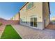 Paver patio and small patch of green complete the cozy backyard space at 7775 Tyrell Peaks St, Las Vegas, NV 89139