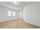 Bright bedroom with wood-look laminate flooring and a window at 7775 Tyrell Peaks St, Las Vegas, NV 89139