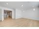 Spacious bonus room with recessed lighting, featuring light wood floors and bright white walls at 7775 Tyrell Peaks St, Las Vegas, NV 89139