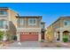 Two-story home with a red brick driveway, matching garage door, and manicured landscaping at 7775 Tyrell Peaks St, Las Vegas, NV 89139