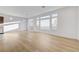 Bright and airy living room featuring beautiful hardwood floors and lots of natural light at 7775 Tyrell Peaks St, Las Vegas, NV 89139