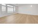 Spacious living room features hardwood floors and lots of natural light shining through large windows at 7775 Tyrell Peaks St, Las Vegas, NV 89139