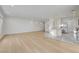 Expansive living area featuring beautiful hardwood floors, natural light, and access to the kitchen at 7775 Tyrell Peaks St, Las Vegas, NV 89139