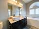 Bathroom featuring double sinks, bathtub, and natural light from a window at 8125 Rio De Janeiro Dr, Las Vegas, NV 89128
