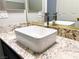 Close up of a modern vessel sink and chrome faucet set on a granite countertop at 8125 Rio De Janeiro Dr, Las Vegas, NV 89128