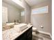 Modern bathroom featuring a vessel sink with a granite countertop and plantation shutters at 8125 Rio De Janeiro Dr, Las Vegas, NV 89128