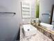 Modern bathroom with white rectangular sink, granite countertop, and mirrored medicine cabinet at 8125 Rio De Janeiro Dr, Las Vegas, NV 89128