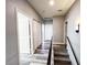 Upstairs hallway featuring a staircase, gray paint and wood-style flooring leading to closets at 8125 Rio De Janeiro Dr, Las Vegas, NV 89128