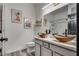 Bathroom with double vanity, vessel sinks, framed art and enclosed shower at 825 Royal Moon Ave, Las Vegas, NV 89123