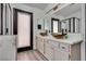 Elegant bathroom vanity with dual vessel sinks and black framed glass shower at 825 Royal Moon Ave, Las Vegas, NV 89123