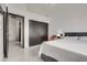 This spacious bedroom showcases large closet, plush bedding, and stylish gray color palette at 825 Royal Moon Ave, Las Vegas, NV 89123