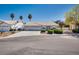 Charming single-story home with a three-car garage and well-maintained landscaping at 825 Royal Moon Ave, Las Vegas, NV 89123