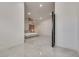 Tiled hallway leads to a bright, spacious main bedroom with recessed lighting at 825 Royal Moon Ave, Las Vegas, NV 89123