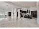 Spacious open floor plan including living room and modern kitchen with seating at 825 Royal Moon Ave, Las Vegas, NV 89123