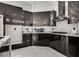 Modern kitchen with sleek black cabinets and stylish countertops at 825 Royal Moon Ave, Las Vegas, NV 89123