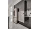 Modern kitchen with stainless steel refrigerator and storage cabinets with white countertops at 825 Royal Moon Ave, Las Vegas, NV 89123