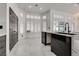 Bright and airy kitchen featuring an island, white tile floors, and a cozy eating area at 825 Royal Moon Ave, Las Vegas, NV 89123