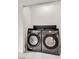 A compact laundry space features a modern washer and dryer set in a minimalist setting at 825 Royal Moon Ave, Las Vegas, NV 89123