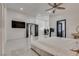 This spacious main bedroom boasts tiled flooring, modern decor, and great natural light at 825 Royal Moon Ave, Las Vegas, NV 89123