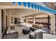 Covered patio with ample seating, perfect for outdoor dining and relaxation at 825 Royal Moon Ave, Las Vegas, NV 89123