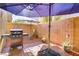 Outdoor patio space with a barbecue grill, perfect for outdoor cooking and entertaining at 8656 Rowland Bluff Ave, Las Vegas, NV 89178