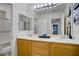 Bathroom featuring double sinks, white countertops, a large mirror, and a bathtub/shower combo at 8656 Rowland Bluff Ave, Las Vegas, NV 89178
