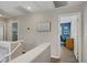 Hallway showcasing neutral walls, hardwood floors and access to bedroom and office at 8656 Rowland Bluff Ave, Las Vegas, NV 89178