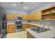 Modern kitchen with stainless steel appliances and ample cabinet space for storage at 8656 Rowland Bluff Ave, Las Vegas, NV 89178