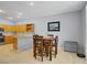 Well-lit kitchen and adjacent dining area featuring wood cabinets and stainless steel appliances at 8656 Rowland Bluff Ave, Las Vegas, NV 89178