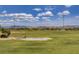 Large open green space in the community park featuring walking path and mountain views at 8656 Rowland Bluff Ave, Las Vegas, NV 89178