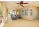 Spacious covered patio features outdoor lounge furniture, ceiling fans, and a view of the private backyard area at 8875 Tidal Bay Dr, Las Vegas, NV 89117