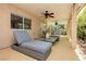 Inviting covered patio featuring comfortable lounge seating, dining area, and scenic views of the landscaped backyard at 8875 Tidal Bay Dr, Las Vegas, NV 89117