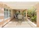 Covered patio with outdoor dining, ceiling fan, and outdoor furniture overlooking a beautifully landscaped yard at 8875 Tidal Bay Dr, Las Vegas, NV 89117