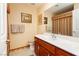 Cozy bathroom featuring a wood vanity, framed art, and a well-lit mirror for a refreshing and practical space at 8875 Tidal Bay Dr, Las Vegas, NV 89117