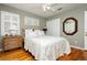 Comfortable bedroom with hardwood floors, bright natural light and side table at 8875 Tidal Bay Dr, Las Vegas, NV 89117