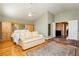 Bright bedroom featuring hardwood floors,vaulted ceiling, and doorway access to hall at 8875 Tidal Bay Dr, Las Vegas, NV 89117