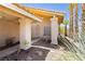 Inviting home entryway showing beautiful decorative rock landscaping and a security gate at 8875 Tidal Bay Dr, Las Vegas, NV 89117