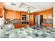 Modern kitchen with tile countertops, oak cabinets, and stainless steel gas cooktop at 8875 Tidal Bay Dr, Las Vegas, NV 89117