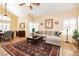 Inviting living room featuring high ceilings, tiled floors, and stylish furnishings at 8875 Tidal Bay Dr, Las Vegas, NV 89117