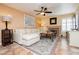 Cozy living room with a fireplace, comfortable seating, and tiled floors at 8875 Tidal Bay Dr, Las Vegas, NV 89117