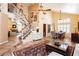 Inviting living room with tiled floors, staircase, and stylish decor and furnishings at 8875 Tidal Bay Dr, Las Vegas, NV 89117