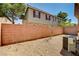 This backyard has minimal landscaping and a privacy wall at 9115 Canoga Canyon Ct # 103, Las Vegas, NV 89149